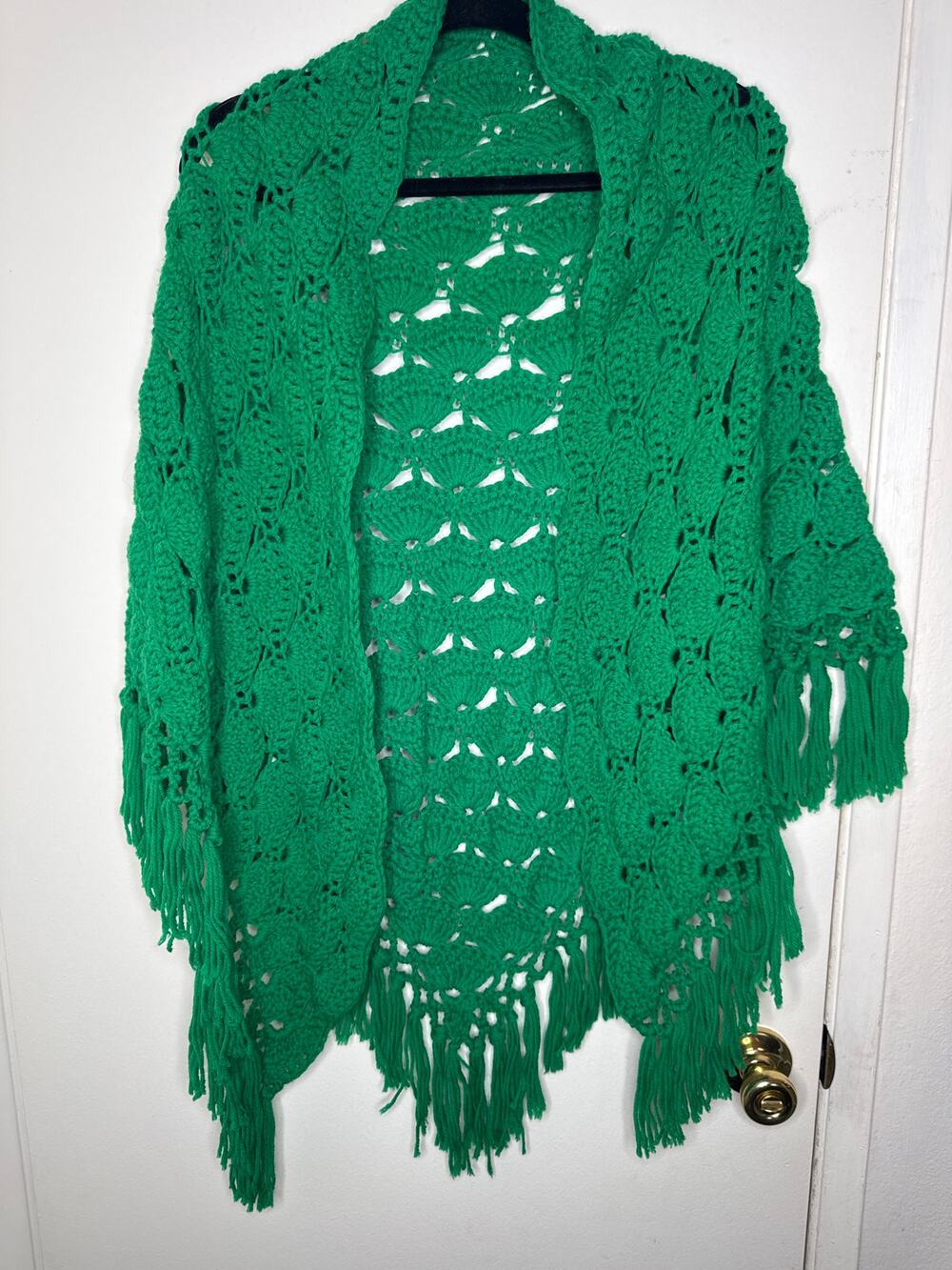 Crocheted green shawl or couch sitter